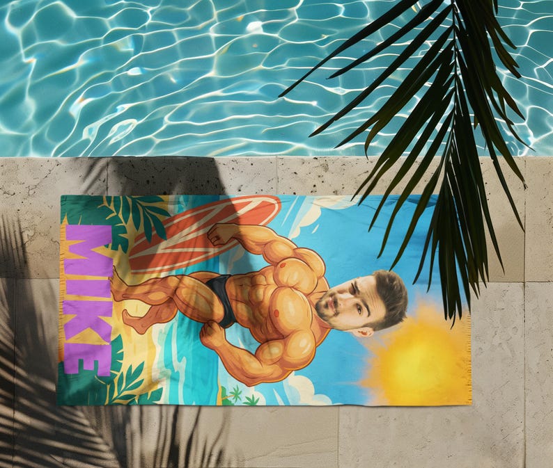 Muscle man towel on the beach