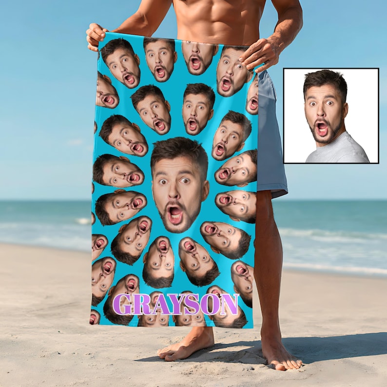 Funny face towel on the beach